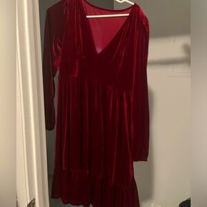 Halra dress that has never been worn . The dress is soft and breezy .